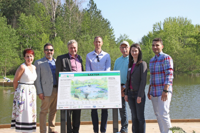 Funders of the Baxter Pond Restoration Project gather to unveil the new interpretive sign developed as part of the improvement efforts — (left to right) Jeanine Maciver (Don Maciver Memorial Fund), Michael Poliwada (former RVCF Executive Director), Adrian Smith (Manager TD Bank, Manotick), Ryan Polkinghorne (Project Manager Surface Water Engineering Support Services, City of Ottawa), Bill McShane (ASL Agrodrain President), Sommer Casgrain-Robertson (RVCA General Manager), Sandro Ricci (ASL Agrodrain Vice President of Business).